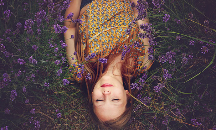 woman lying in flowers